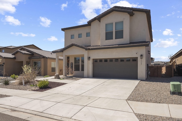 view of front of home featuring driveway, an attached garage, fence, cooling unit, and stucco siding