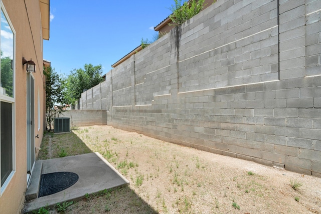 view of yard featuring central AC