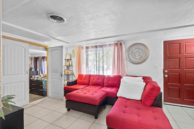 tiled living room with a textured ceiling