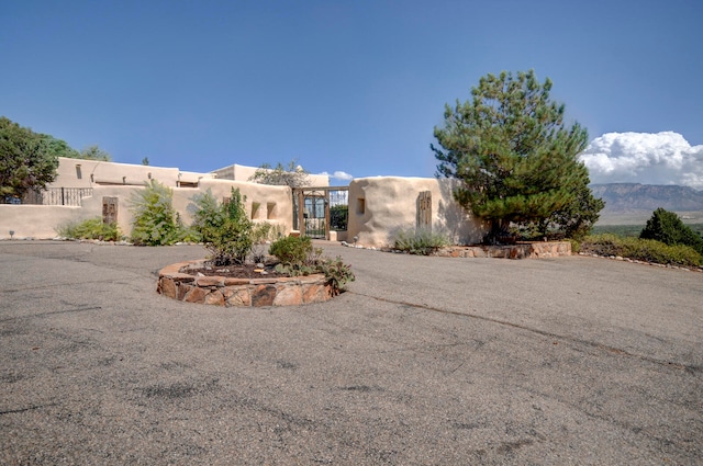 pueblo-style home featuring a mountain view