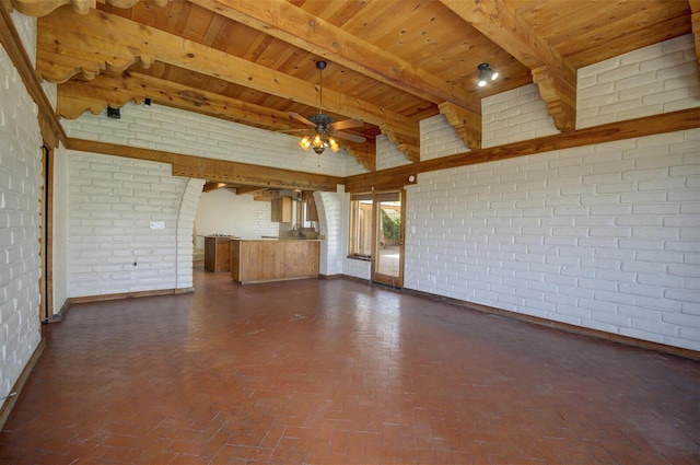 unfurnished living room with brick floor, wood ceiling, brick wall, and a ceiling fan