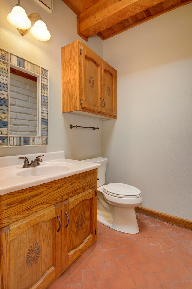 bathroom with wood ceiling, vanity, toilet, and beamed ceiling