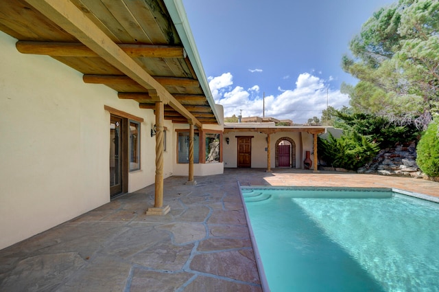 view of swimming pool with a patio area