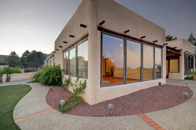 rear view of property featuring a patio area