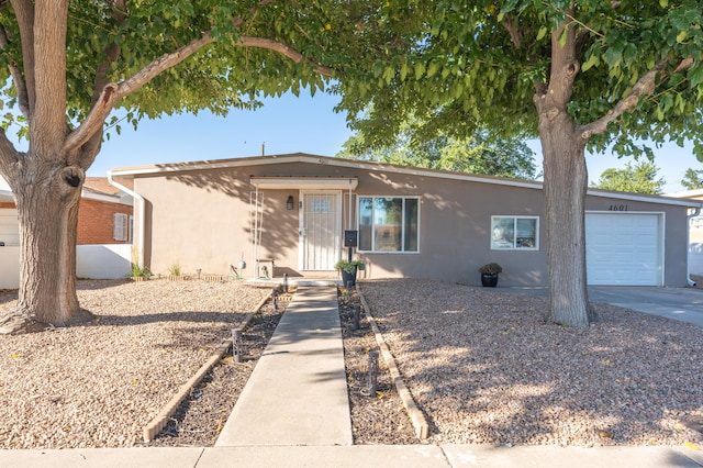 ranch-style home featuring a garage