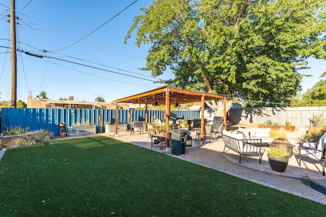 view of yard featuring a patio and an outdoor living space with a fire pit