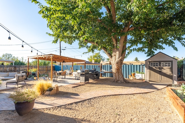 view of yard with a fire pit, a storage unit, and a patio area