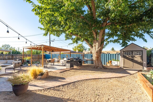 4601 Palo Duro Ave NE, Albuquerque, NM 87110 - view of yard with an outdoor living space, a patio area, a shed, a fenced backyard, and an outbuilding