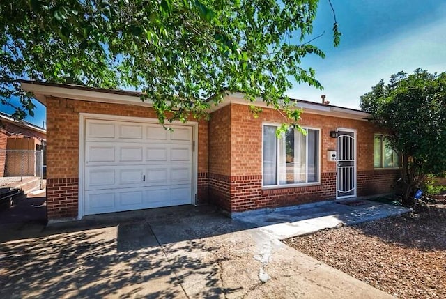 ranch-style home featuring a garage