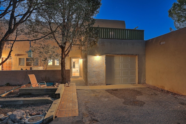 southwest-style home with a garage