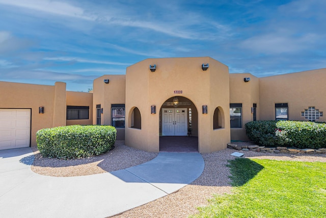 1220 Mesa Ridge Dr SW, Los Lunas, NM 87031 - pueblo revival-style home featuring stucco siding