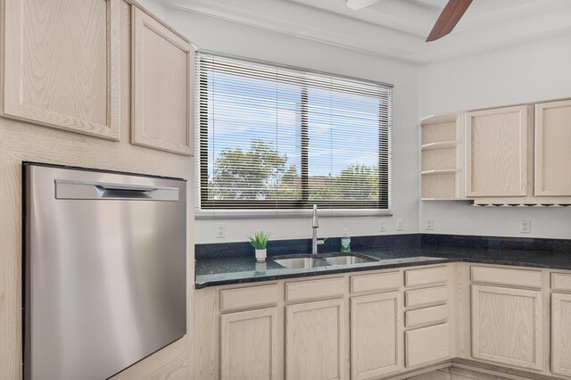 1220 Mesa Ridge Dr SW, Los Lunas, NM 87031 - kitchen with stainless steel dishwasher, a sink, a ceiling fan, open shelves, and dark stone counters