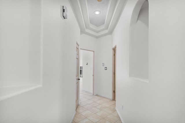 hallway featuring light tile patterned floors