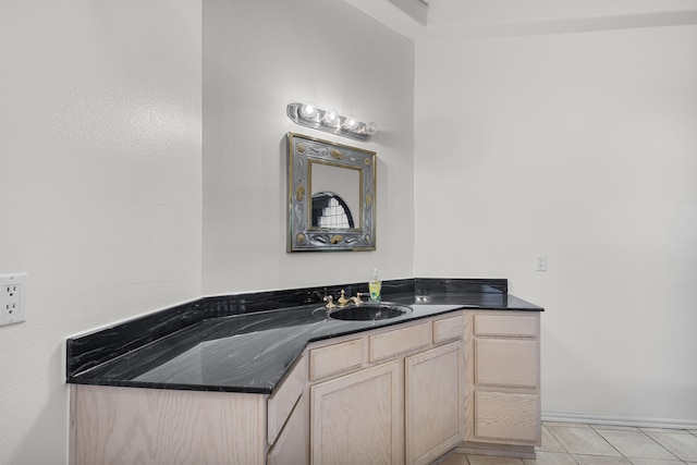 bathroom with vanity and tile patterned flooring