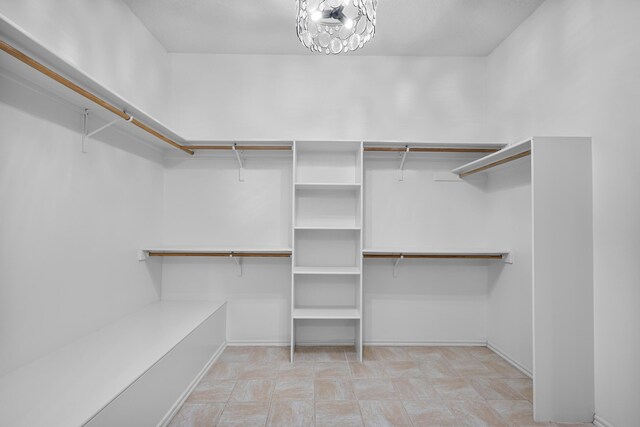 1220 Mesa Ridge Dr SW, Los Lunas, NM 87031 - spacious closet with a chandelier