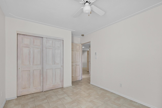 1220 Mesa Ridge Dr SW, Los Lunas, NM 87031 - unfurnished bedroom with a closet, baseboards, and ceiling fan