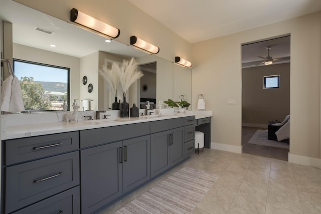 bathroom featuring tile patterned flooring, ceiling fan, and vanity