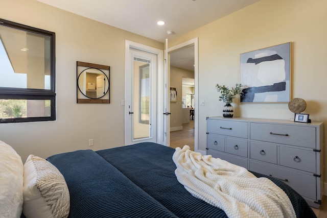 bedroom with hardwood / wood-style floors