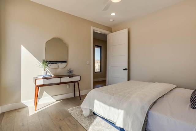 bedroom featuring light hardwood / wood-style flooring and ceiling fan