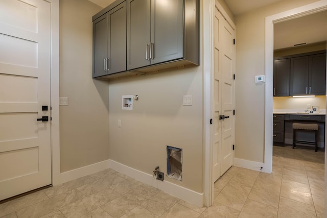 washroom with hookup for a washing machine, cabinets, gas dryer hookup, and electric dryer hookup