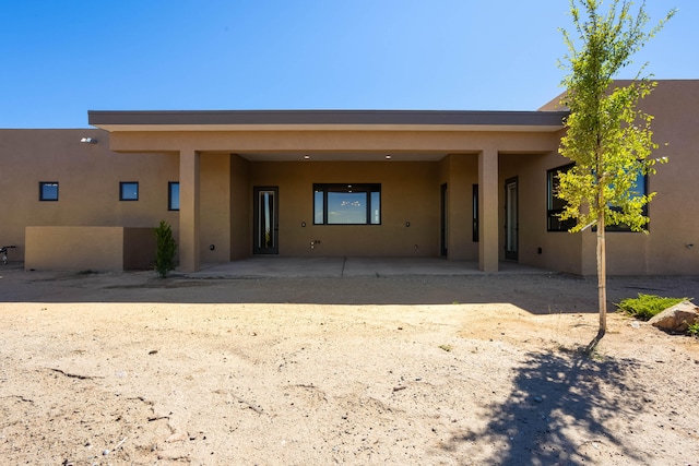 rear view of house featuring a patio