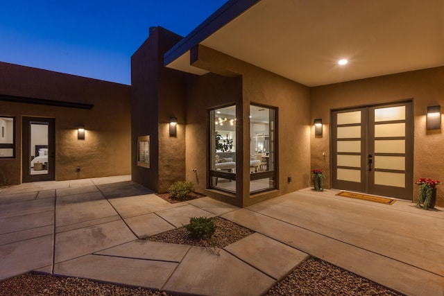 doorway to property with a patio area