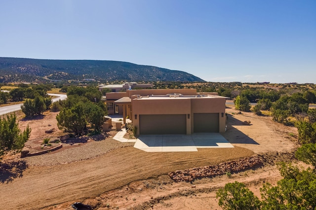 exterior space featuring a mountain view and a garage