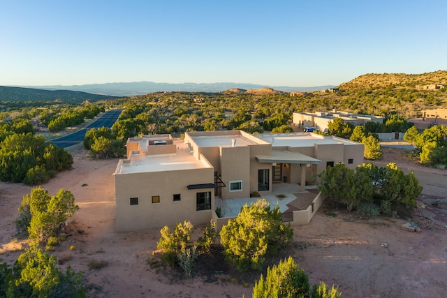 drone / aerial view featuring a mountain view