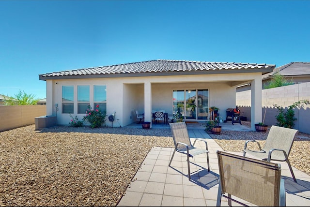 back of house featuring a patio area