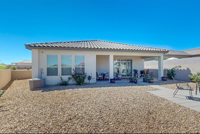 back of house featuring a patio and cooling unit