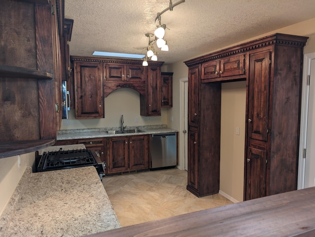 kitchen featuring stove, stainless steel dishwasher, a textured ceiling, rail lighting, and light stone countertops