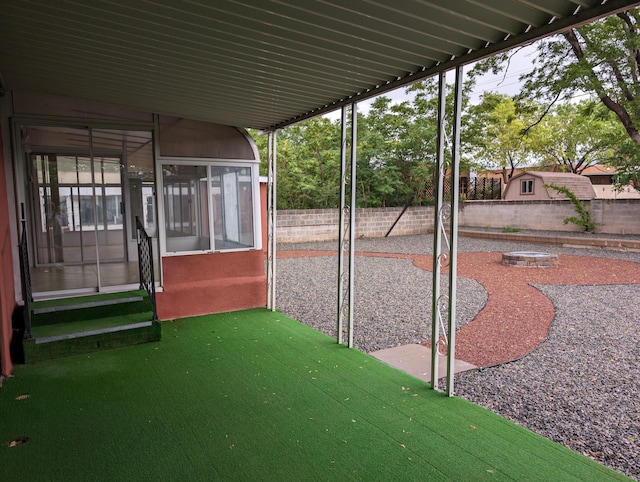 view of patio with a sunroom