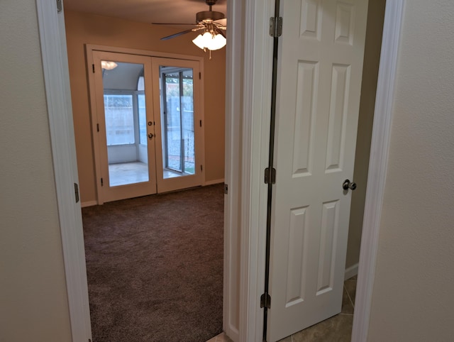 hallway with french doors and carpet flooring