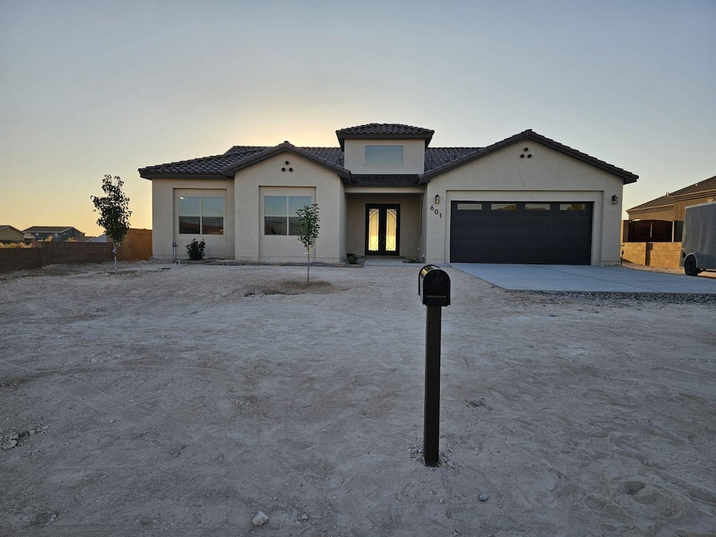 mediterranean / spanish house featuring a garage