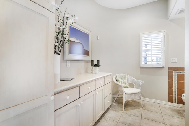 bathroom featuring tile patterned flooring, toilet, vanity, and visible vents