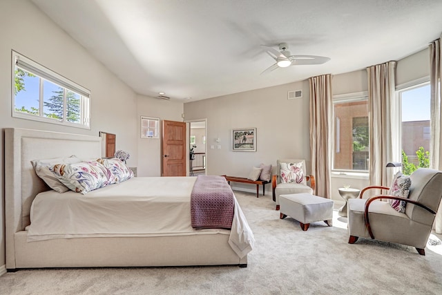 carpeted bedroom featuring visible vents and a ceiling fan