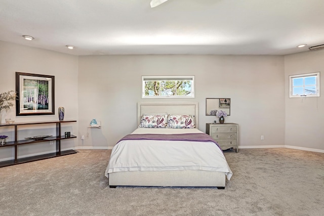 carpeted bedroom featuring baseboards