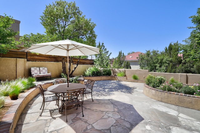 view of patio / terrace featuring outdoor dining space and a fenced backyard