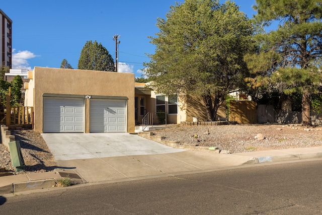 adobe home featuring a garage