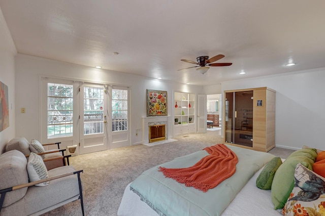 bedroom with ceiling fan, crown molding, access to exterior, and carpet