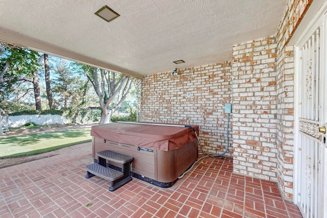 view of patio featuring a hot tub