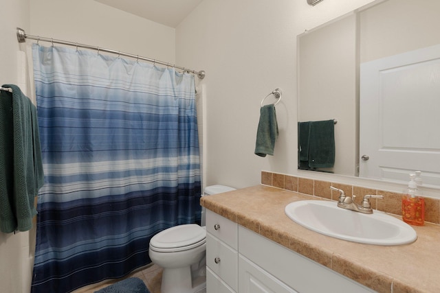 bathroom featuring vanity, a shower with curtain, toilet, and tile patterned flooring