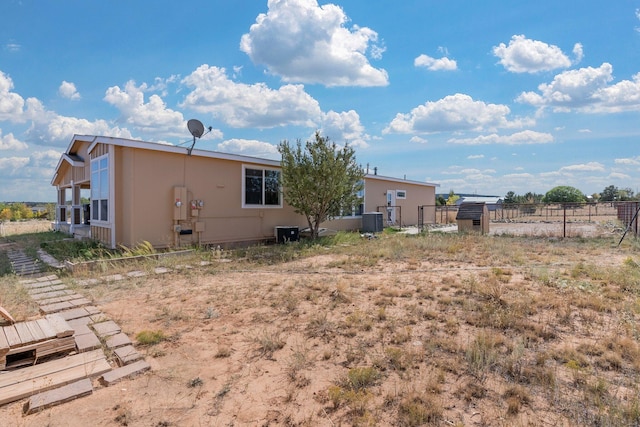 back of property with central AC unit