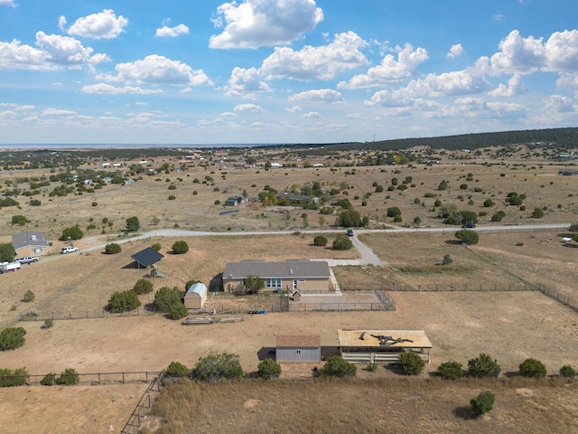 birds eye view of property with a rural view