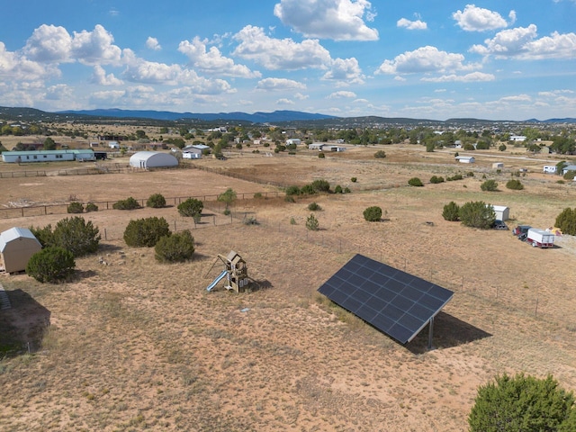 birds eye view of property with a mountain view