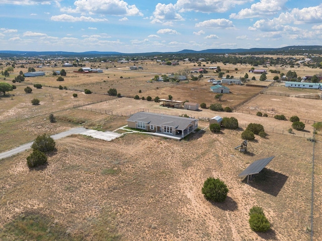 drone / aerial view with a mountain view and a rural view