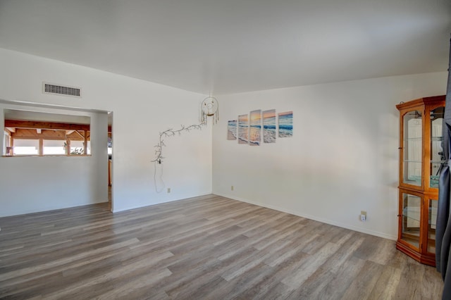 empty room with light hardwood / wood-style floors