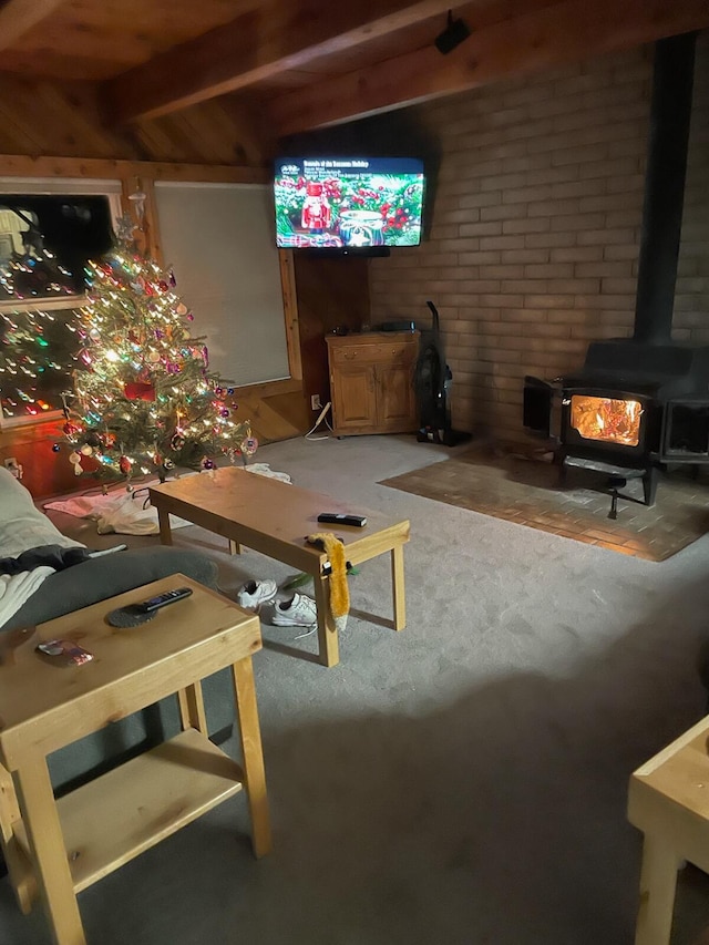 carpeted living room with a wood stove, beam ceiling, and wood walls