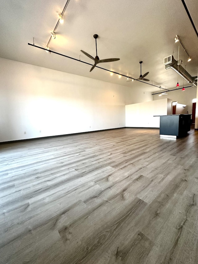 garage featuring ceiling fan, visible vents, and baseboards