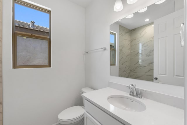 full bathroom featuring a shower, toilet, and vanity